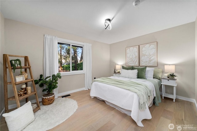 bedroom with light wood-type flooring