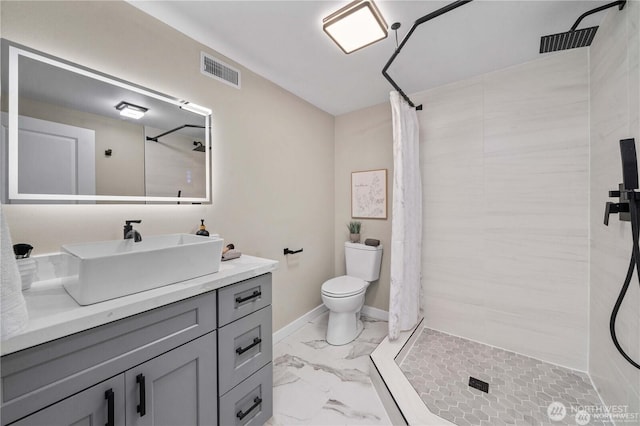 bathroom with vanity, a shower with curtain, and toilet