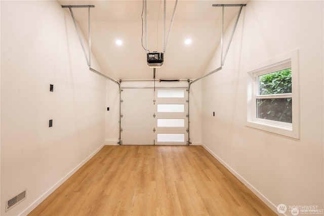 garage featuring a garage door opener