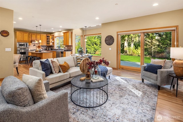 living room featuring recessed lighting and light wood finished floors