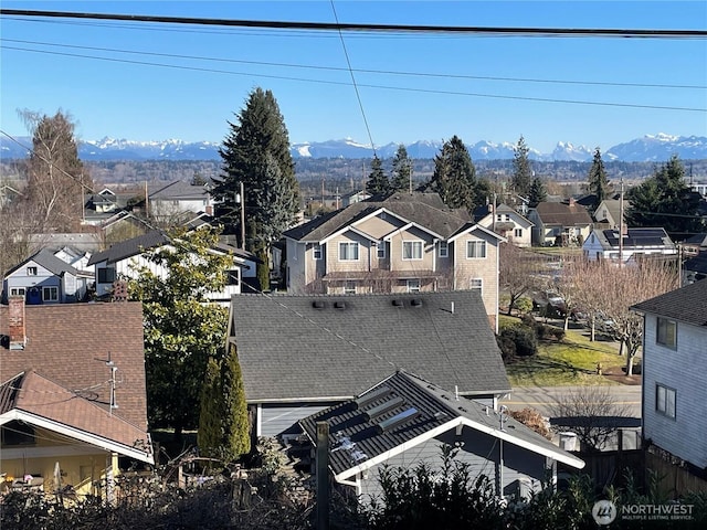 drone / aerial view featuring a residential view and a mountain view