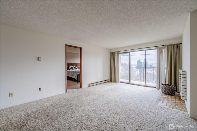 unfurnished room featuring carpet, a textured ceiling, and a baseboard radiator