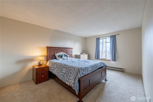 bedroom featuring light carpet, a textured ceiling, and a baseboard radiator