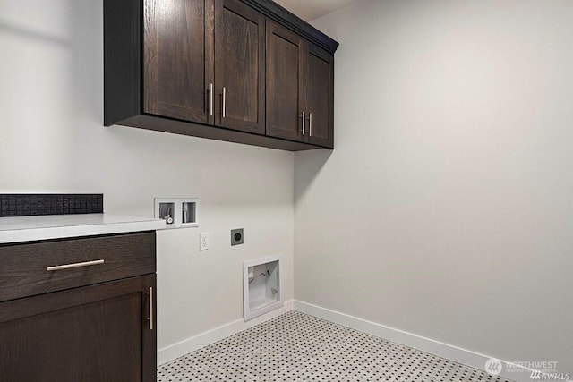 clothes washing area featuring cabinets, washer hookup, and electric dryer hookup