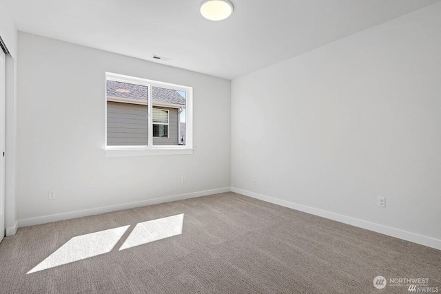 view of carpeted spare room