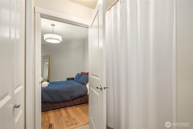 bedroom with wood finished floors