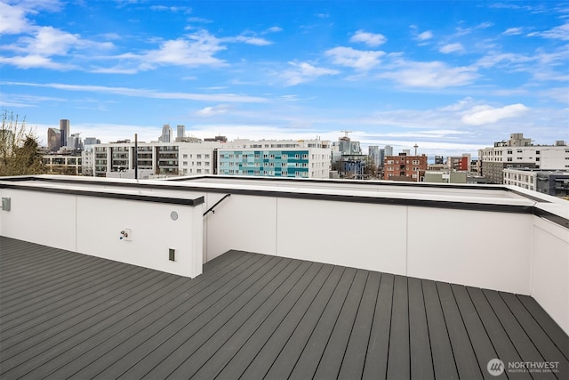 wooden deck with a view of city