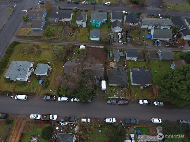 birds eye view of property with a residential view