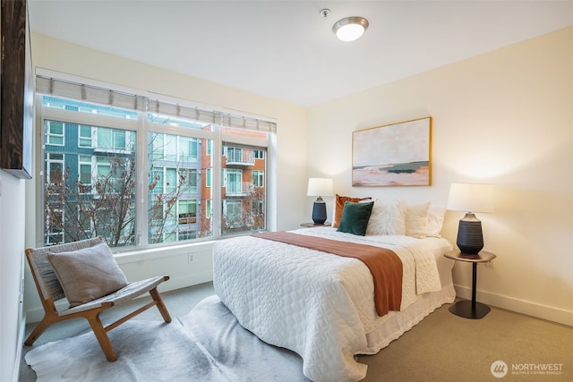 carpeted bedroom with baseboards