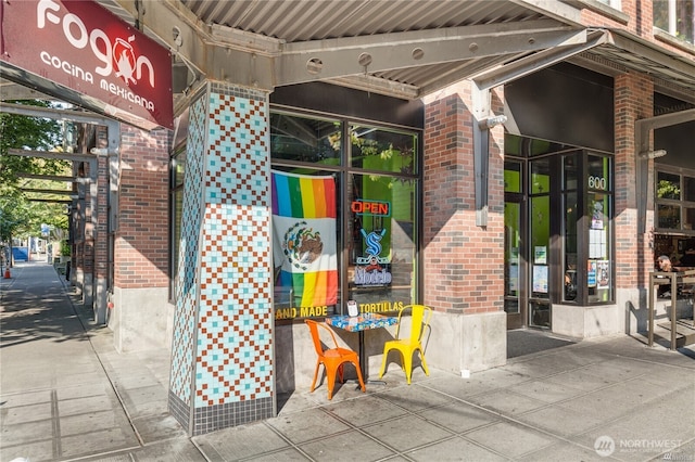 exterior space featuring brick siding