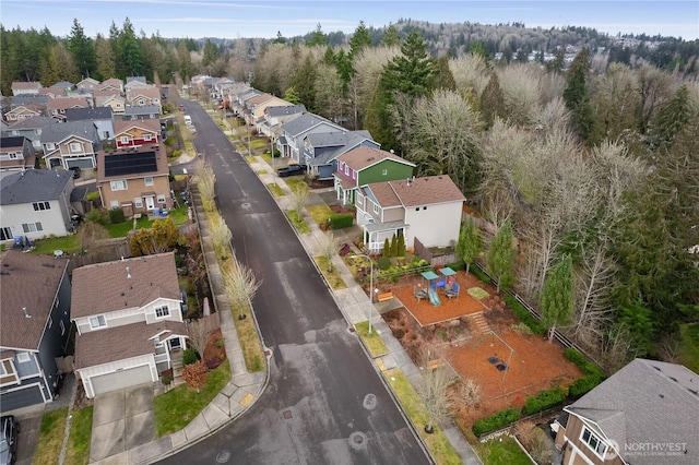 birds eye view of property with a residential view