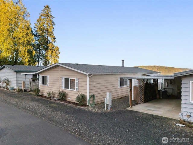 view of home's exterior with a carport