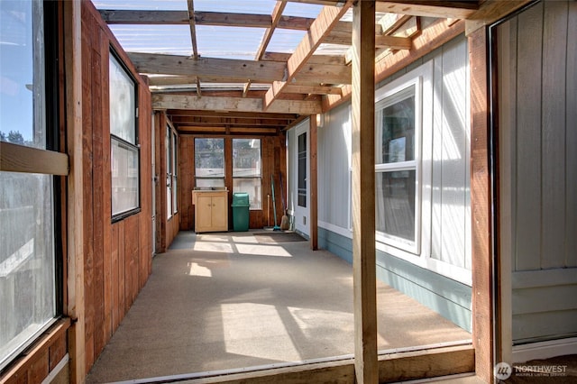 unfurnished sunroom featuring a healthy amount of sunlight