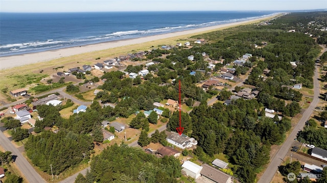 aerial view featuring a water view, a residential view, and a view of the beach