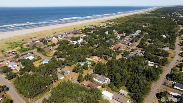 aerial view featuring a residential view, a water view, and a beach view