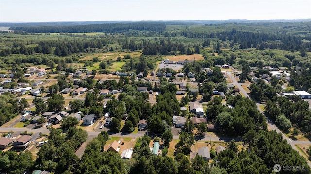 bird's eye view featuring a residential view and a view of trees