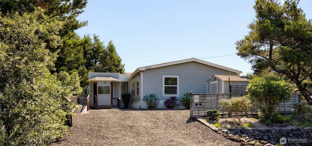 ranch-style home with a shed