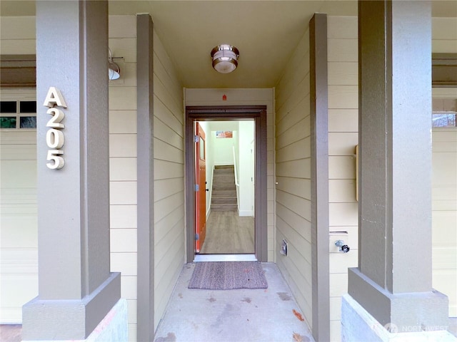 doorway to property with a garage