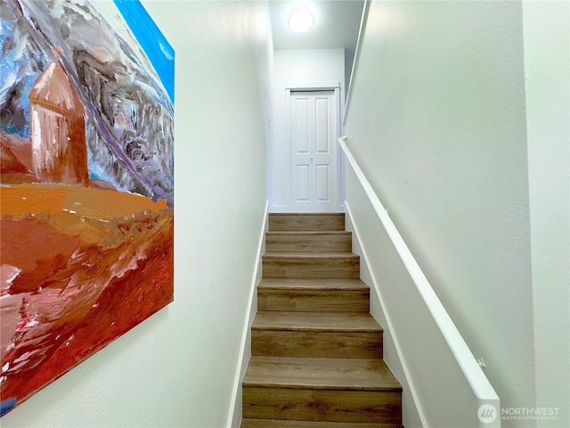 stairs with wood finished floors