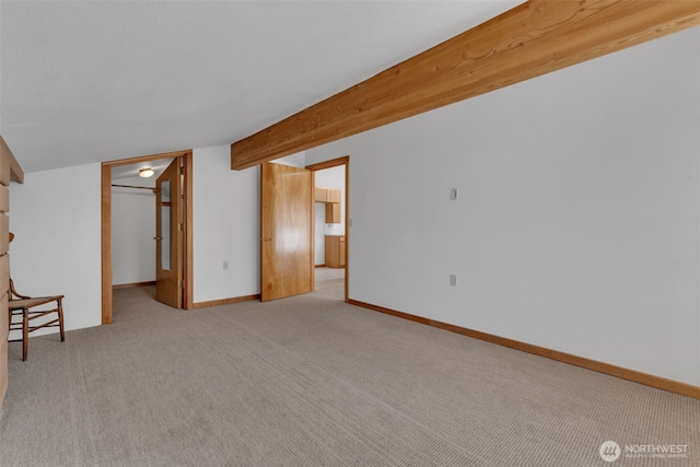 interior space with carpet and baseboards