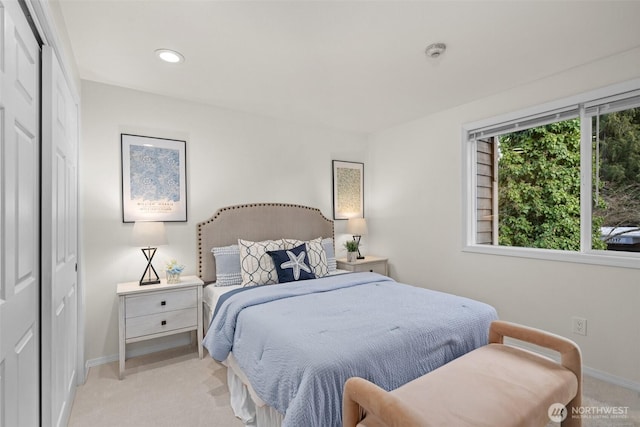 bedroom featuring recessed lighting, baseboards, and light colored carpet