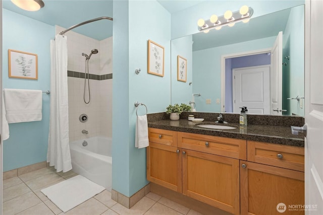 full bath featuring shower / tub combo with curtain, vanity, baseboards, and tile patterned floors