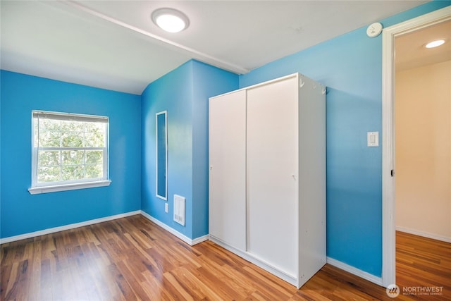 1314 N Callow Ave, Bremerton, WA 98312 - unfurnished bedroom with a closet, visible vents, wood finished floors, and baseboards