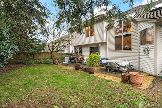 view of yard featuring fence and a patio