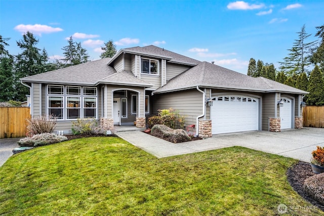 view of front of home featuring a garage, roof with shingles, and fence