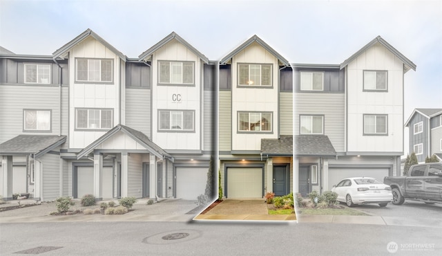 townhome / multi-family property featuring a garage, a shingled roof, and board and batten siding