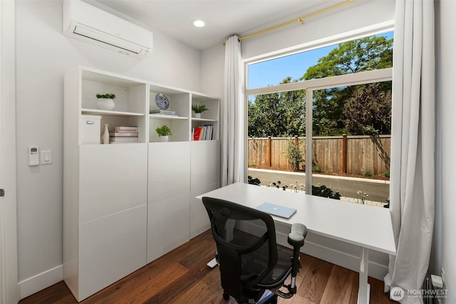 office area featuring a wall unit AC, dark wood-type flooring, and recessed lighting