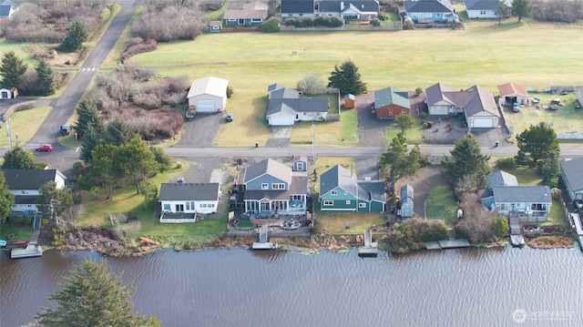 bird's eye view with a residential view and a water view