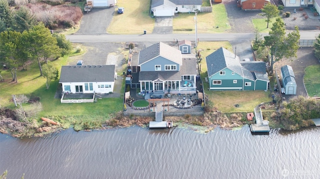 bird's eye view featuring a water view and a residential view