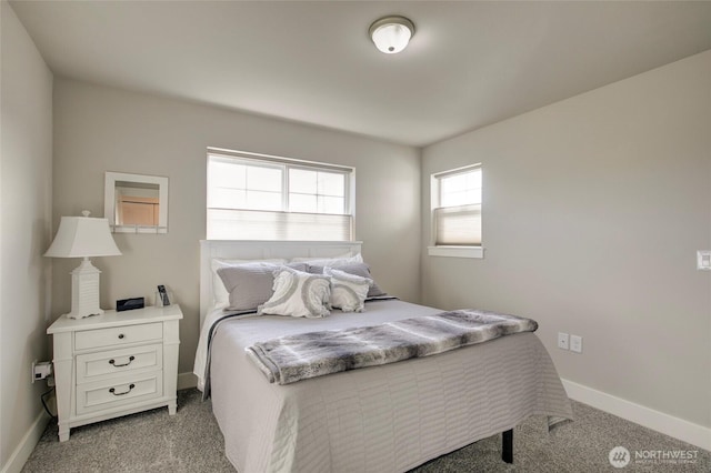 bedroom featuring baseboards and light colored carpet