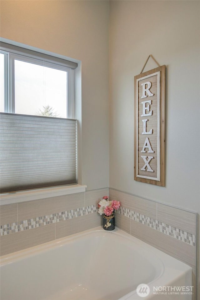 full bathroom with a garden tub