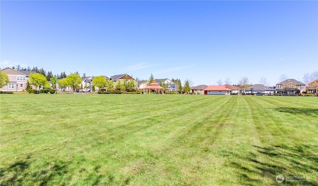 view of yard featuring a residential view