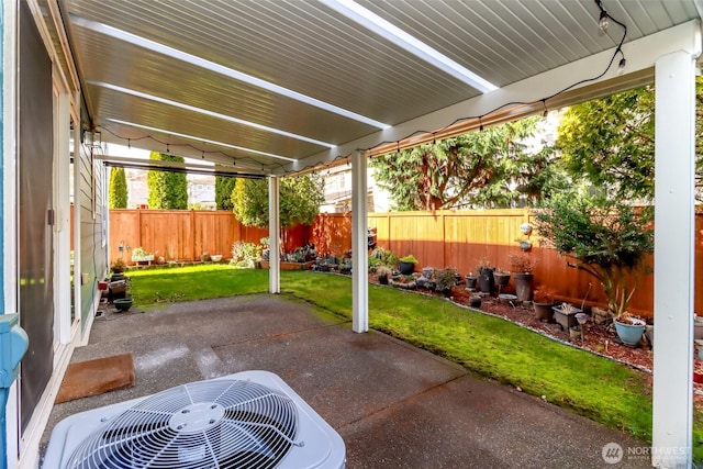 view of patio with a fenced backyard and central AC unit