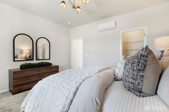 carpeted bedroom with a wall unit AC and a chandelier