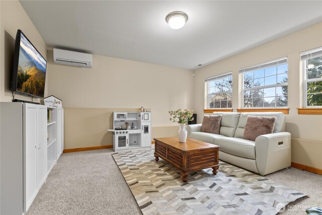 living area featuring light colored carpet, a wall mounted air conditioner, and baseboards