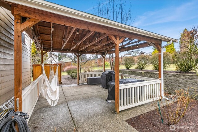 view of patio with fence and area for grilling