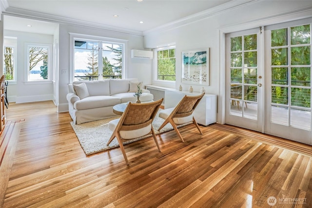 sunroom / solarium with plenty of natural light and a wall mounted AC