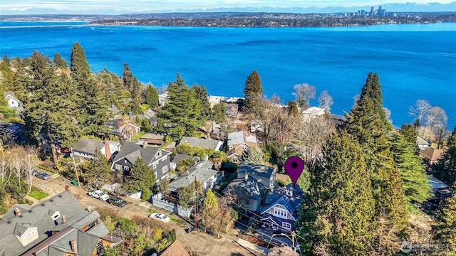 bird's eye view with a water view and a residential view