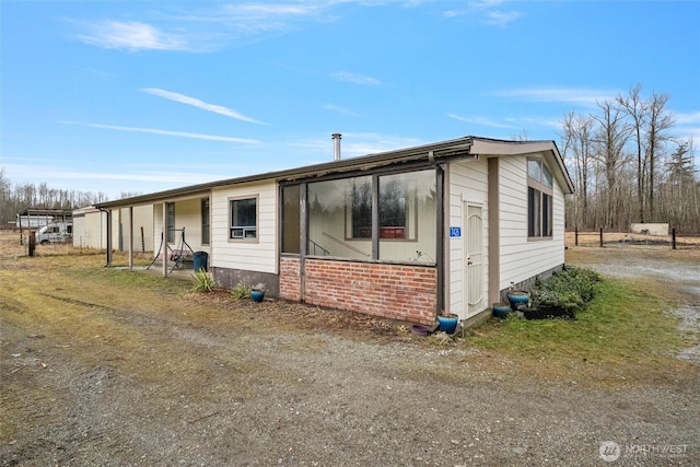 view of front of property featuring brick siding