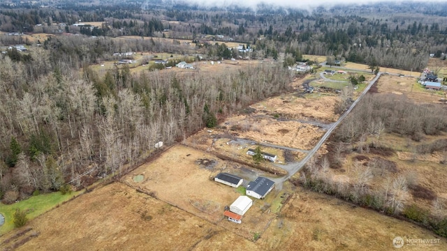 drone / aerial view featuring a view of trees