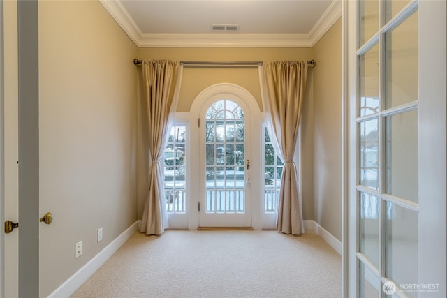 doorway to outside with carpet floors, visible vents, crown molding, and baseboards