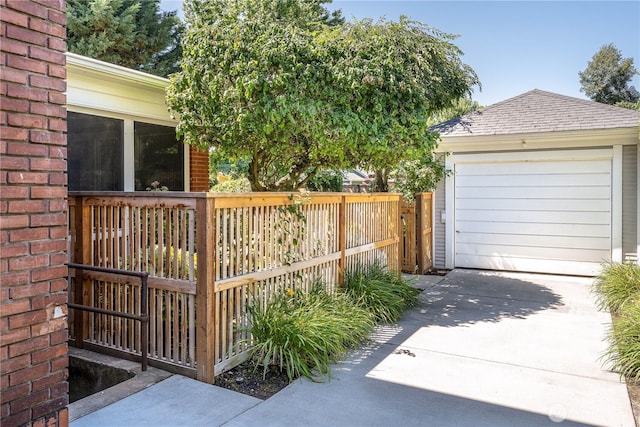 exterior space with driveway and fence