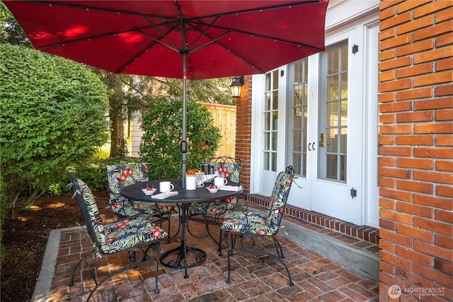 view of patio with outdoor dining space and french doors