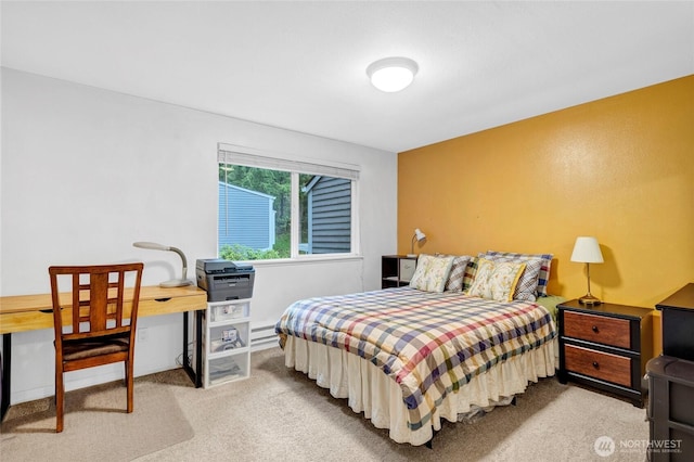 bedroom with light carpet and a baseboard radiator