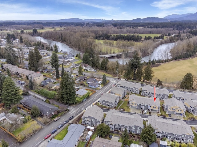 aerial view featuring a residential view and a water and mountain view