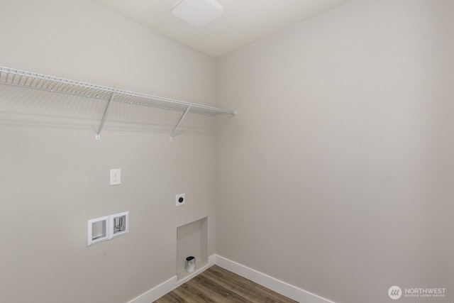 clothes washing area featuring laundry area, baseboards, wood finished floors, hookup for a washing machine, and electric dryer hookup